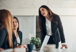 © Flamingo Images - CEO listening to her team during a boardroom meeting in an office