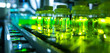 Detailed view focusing on reflective surfaces of a bioreactor setup under vibrant lime light. Highlighting lively atmosphere of innovation in the lab
