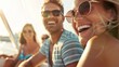© Justlight - A group of smiling friends and family gather on the spacious deck of a luxurious yacht. The bright sun shines down on them highlighting their relaxed and happy expressions