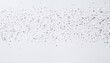 White background with small silver dots