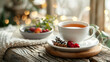 A steaming cup of berry tea with cinnamon sticks for a warm and flavorful drink