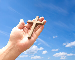 Wall Mural - Cross in arm at blue sky. Good Friday concept. 3d illustration