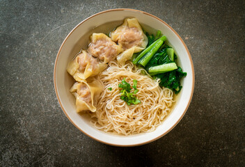 Wall Mural - egg noodles with pork wonton soup or pork dumplings soup and vegetable