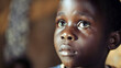 Boy looking sad, close up face, children in Africa despite facing adversity