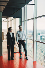 Wall Mural - Successful group of colleagues having a working discussion in the office. Leaders during a friendly conversation. Concept of business. Business conversation between colleagues