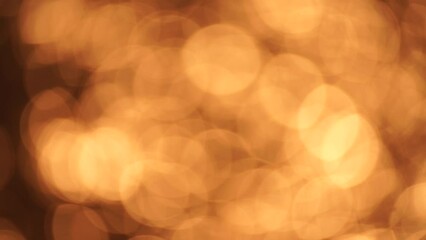 Wall Mural - Abstract Blurred video screensaver bokeh golden sea at sunset. The sun reflects and sparkles on the waves.