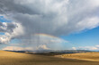 © Simona Machackova - Heavy storm in the Tuscany countryside with dramatic light and colorful rainbow above the haystack
