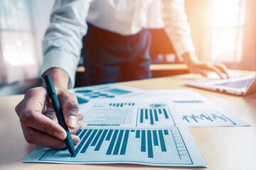 Poster - businessman accountant or financial expert analyze business report graph and finance chart at corpor