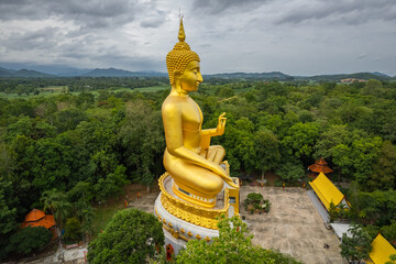 Big Gold Buddha statue at Wat Pha Thang, Uthai Thani, Thailand