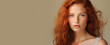 Portrait of an elegant, sexy happy Caucasian woman with perfect skin and red hair, on a creamy beige background, banner.