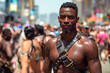 muscular black gay man in leather harness at the LGBT parade on street