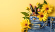 © alla.naumenco - In the pocket of my jeans there are some lipsticks with flowers next to them. light yellow background.