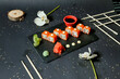 Black Table With Sushi and Chopsticks