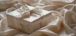 A solitary gift box, wrapped in pale silk, exuding timeless elegance.