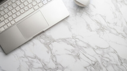 Notebook with keyboard on white marble table. Top view of modern stylish workplace with laptop computer. Copy space. Flat lay.