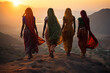 Indian women in colorful sari on top of hill