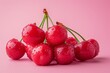 Fresh cherries with water droplets on pink background, juicy and vibrant fruits, summer harvest concept