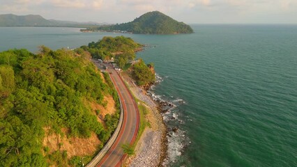 Wall Mural - car driving on the curved road of Chantaburi Province Thailand, Road along the beach and ocean is very beautiful.