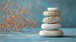 Stack of Stones and Dried Flowers on Wooden Table in Natural Setting, Zenlike Decor Concept