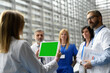 © Halfpoint - Group of doctors discussing test results, looking on tablet, medical team discussing patients diagnosis, searchign for right treatment.