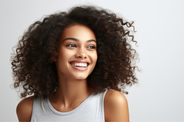 Sticker - Woman with curly hair is smiling and looking at camera