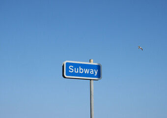 Sticker - subway sign over blue sky