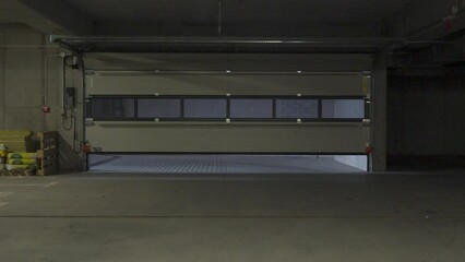 Wall Mural - Garage Door in Underground Parking: Remote-Controlled Opening and Closing