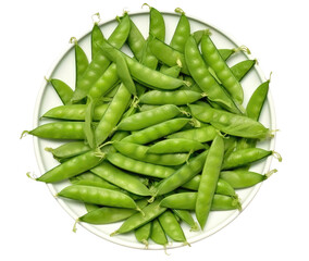 Wall Mural - A white plate with green peas on it. The peas are in a circle and are spread out