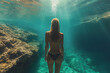 beautiful slender girl swims underwater