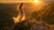 A woman in a long dress stands on a hillside, looking out at the sunset