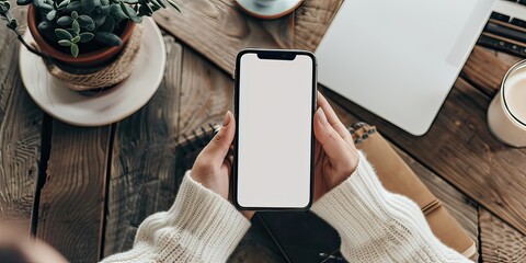 Woman using smartphone blank screen frameless modern design on wood table. Generative AI