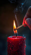 The Illuminating Moment: Igniting the Flame of a Solitary, Red Candle Against a Dark Backdrop