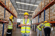 
Professional warehouse worker team celebrating success in warehouse factory, Cheerful workers having fun at work, Happiness at job, Concept of success, Happy team enjoying their successful job