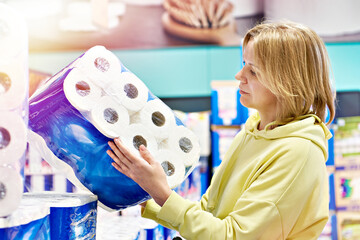 Wall Mural - Woman buying toilet paper