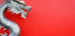 silver metal chinese style dragon side view traditional plain red background banner with copy space