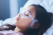 Young girl with oxygen mask in hospital bed, recovering from illness, resting after sickness