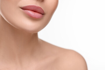 Wall Mural - Woman with beautiful lips on white background, closeup. Space for text