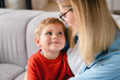 © InsideCreativeHouse - Caring loving young mother hugging embracing her small little toddler kid child son sitting at home together. Motherhood, family, single mother concept