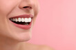 © New Africa - Woman with beautiful lips smiling on pink background, closeup. Space for text