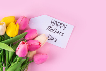 Sticker - Mother day background with tulip flowers bouquet, gift box with pink ribbon and Happy Mother Day tag. Greeting card background, flat lay for poster, brochures, booklets, promotional materials, website