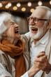 Joyful elderly old couple have fun in dating outside in restaurant dancing and laughing together. Mature man and woman dance and laugh a lot. Youthful lifestyle retired people. Active leisure activity