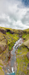 Wall Mural - Aerial view of beautiful Stjornafoss waterfall on a wet rainy day