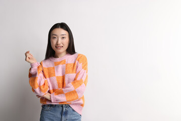 Poster - Portrait of smiling woman on light background. Space for text