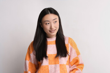 Poster - Portrait of smiling woman on light background