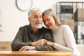 Poster - Happy senior couple signing Last Will and Testament indoors