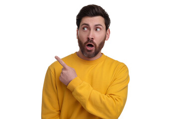 Canvas Print - Surprised man pointing at something on white background