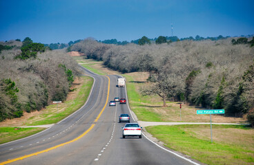 Sticker - Traffic along Texas countryside road in spring season