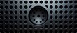 A detailed shot of an automotive speaker featuring a pattern of holes, showcasing its composite material and engineering technology