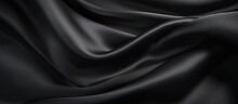 A Closeup Shot Of A Black Satin Fabric With Wavelike Patterns Resembling Water Ripples. The Fabric Exudes A Luxurious Feel, With Shades Of Grey And Electric Blue Hues