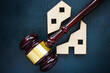 House of two parts and a gavel. Division of real estate in case of divorce or inheritance.